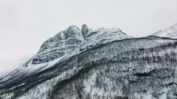 Snow Peak Mountain Hike In Manndalen, Lyngenfjord During Winter In Northern Norway. Aerial Shot alt