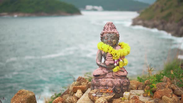 Statuette of the Holy deity, mounted on top of a high cliff above the Bay. alt