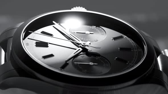 Studio animation of stainless steel luxury watch. Moving light source.