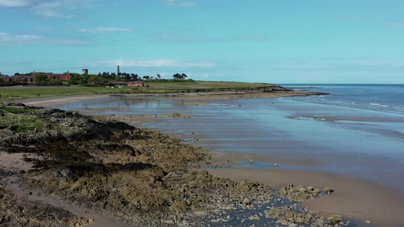 Aerial view over rocky beach landscape alt