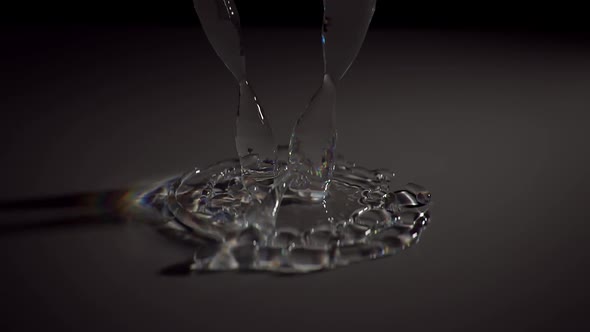 Jet Of Water With Spectral Light Pours Onto The Surface And Spreads