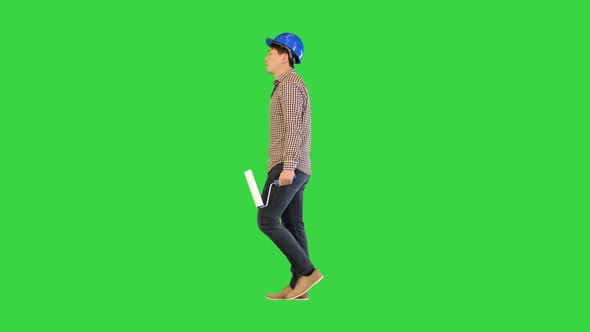 Painter Contractor Walking with a Paint and a Roll on a Green Screen Chroma Key alt