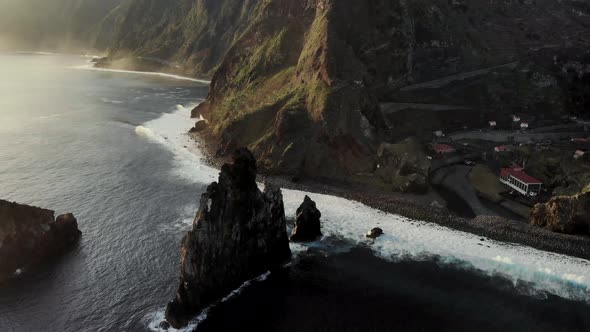 Drone Circle Orbit Around Huge Cliff Revealing Ribeira Da Janela Coast, Madeira Island Portugal