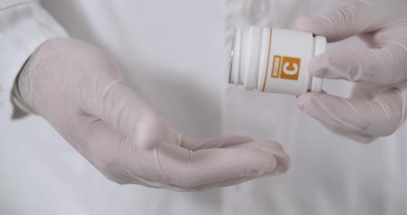 A Box Of Vitamin C In Hands alt