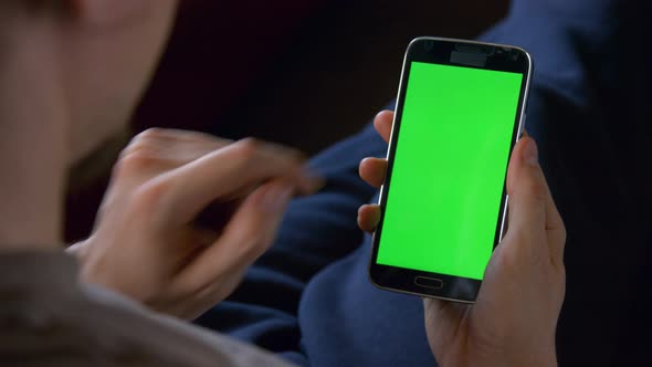 Man Sitting Using Blank Smart Phone
