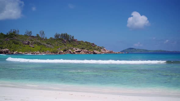 Anse Coco Beach on La Digue, Seychelles. Calm Ocean Waves Rolling To White Sand Tropical Coast and alt