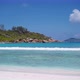 Anse Coco Beach on La Digue, Seychelles. Calm Ocean Waves Rolling To White Sand Tropical Coast and - VideoHive Item for Sale