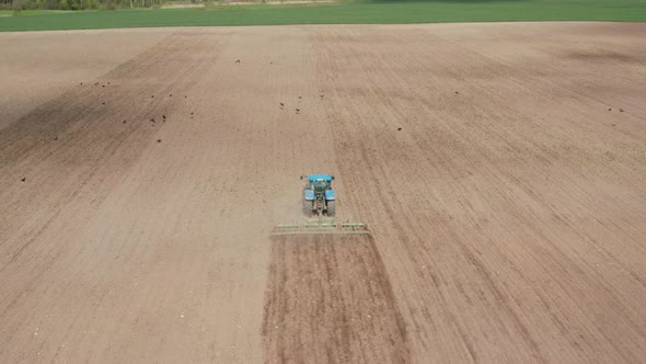 Tractor Plowing the Farm Field