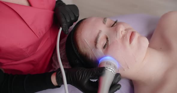 Beautician Does Procedure of the Machine Infrared Face Lifting  60p Prores HQ
