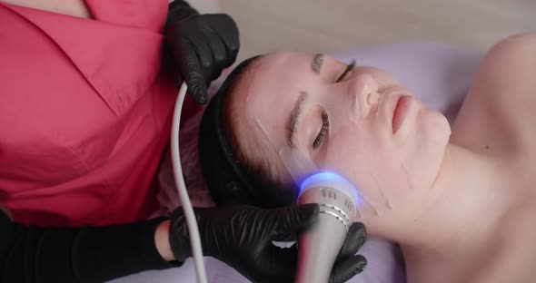 Beautician Does Procedure of the Machine Infrared Face Lifting  60p Prores HQ alt