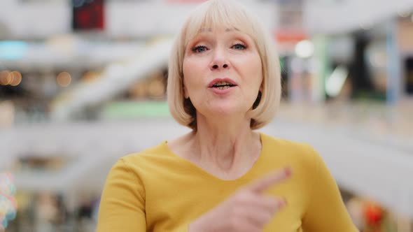 Female Portrait Closeup Mature Serious Caucasian Middleaged Woman Pointing Shaking Finger alt