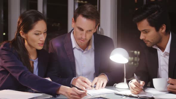 Business people signing agreement alt