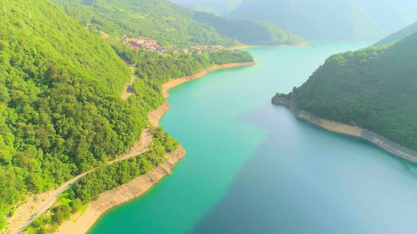 Aerial Video of Mountain Piva Lake and Mountains at Sunset alt