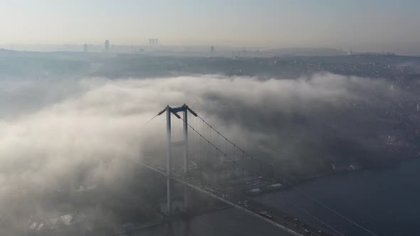 aerial video of bosphorus Bridge on a foggy day in Istanbul, Turkey, Martyrs Bridge  alt