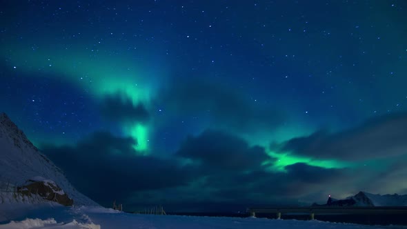 Clouds and Northern Lights in the Night Sky of Lofoten