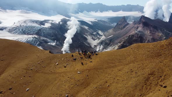 people at a steaming volcano