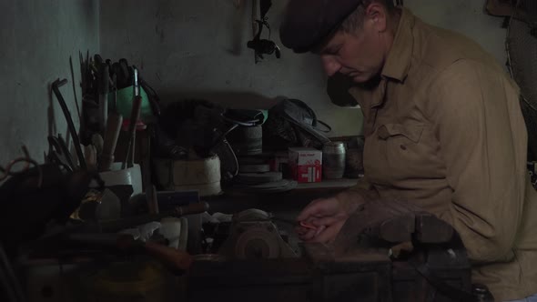 A Man Works in an Old Home Workshop alt