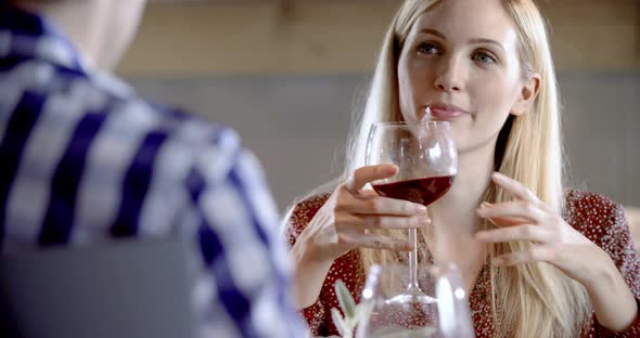 Blonde Woman Eatingdrinking and Talking