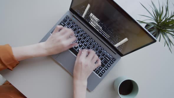 Timelapse of Hands of Female Programmer Writing Computer Code on Laptop alt