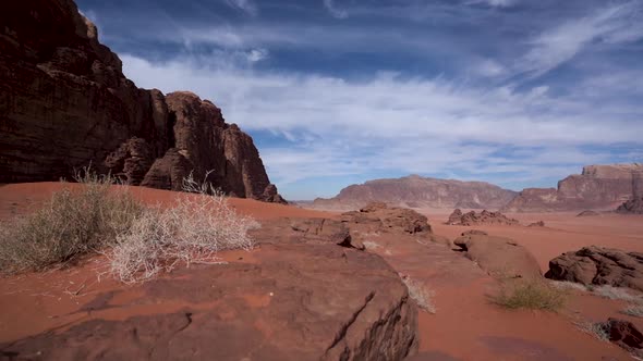 A Beautiful Timelapse of Clouds Moving Above The Desert of Wadi Rum on a Sunny and Bright Day alt