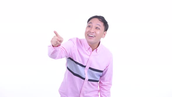 Happy Japanese Businessman Pointing Finger and Looking Surprised alt