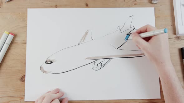 Timelapse of artist drawing an airplane flying alt