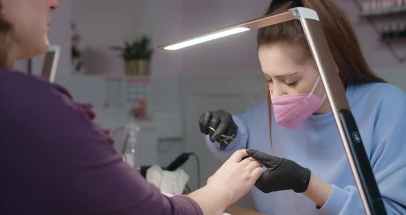 Cosmetologist Manicurist Does Procedure of the Cropp Manicure Beauty Salon Procedures  Prores 60p