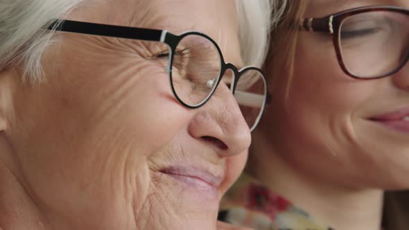 Close Up Shot of Smiling Senior and Young Woman with Glasses. Family Love alt