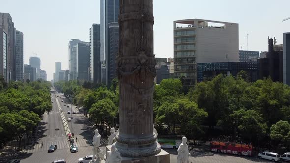 A tilt up shot of the angel of Independence stands in the center of a roundabout in Mexico City, Mex alt