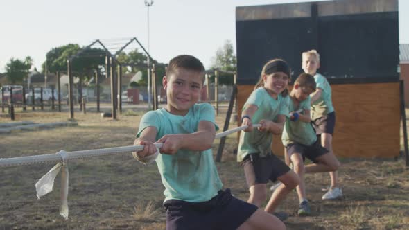 Group of Caucasian children training at boot camp alt