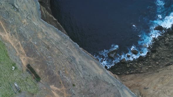 Aerial View Of Steep Cliff Near Ocean
