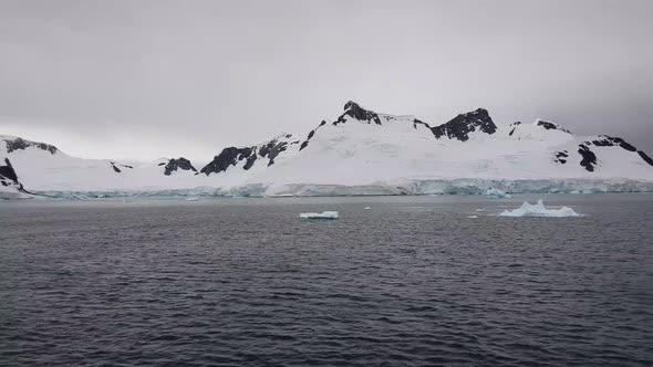 Travel on deep pure waters among glaciers of Antarctica. Fantastic snow landscapes. alt