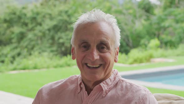 Senior man alone in a garden alt