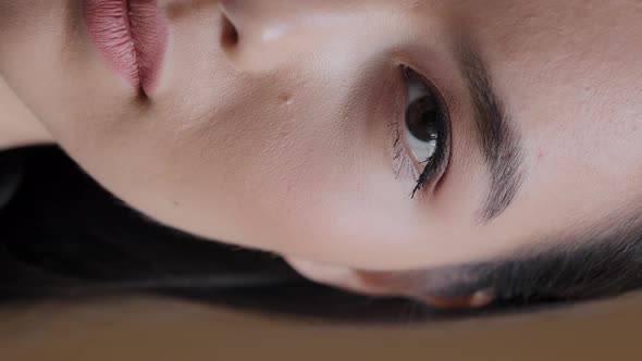 Vertical View Asian Korean Girl Sad Woman Half Human Female Face with Dark Eyes Natural Makeup alt