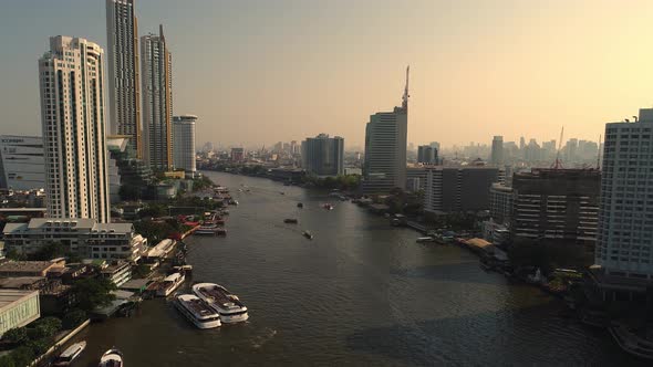4k Aerial city view of Bangkok dowtnown, Flying over Bangkok, Thailand. alt