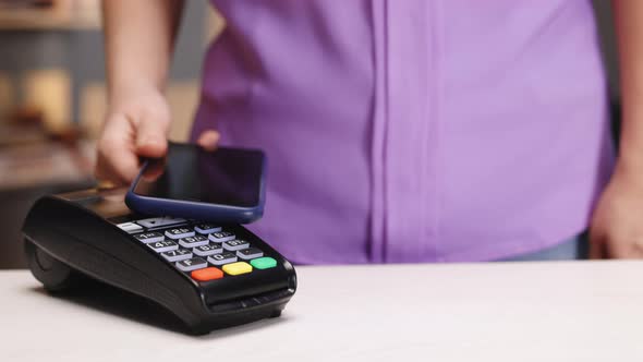 Contactless Payment With Smartphone Cashless Wallet NFC Technology to Pay Order on Bank Terminal