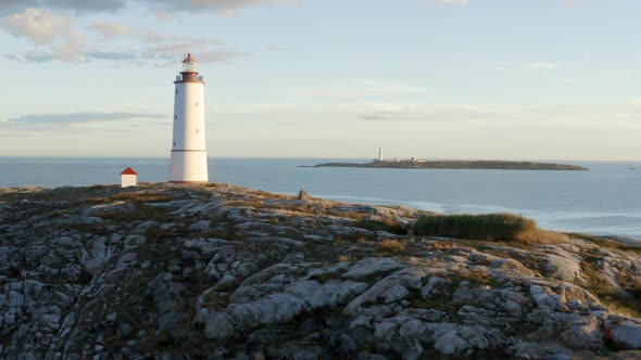 Aerial View Of Lille Torungen Lighthouse And Store Torungen Lighthouse In Arendal, Norway - drone sh alt