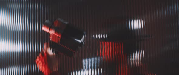 Shape of a vintage camera thorugh shaped clear panel in red lights alt