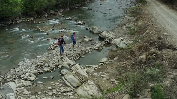 Hikers Crossing River Drone View Cloudy Spring Day Looking Adventure Vacation alt