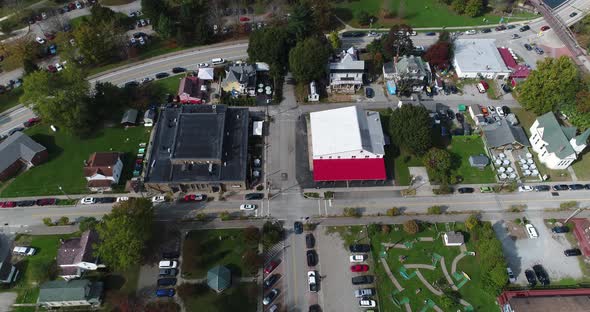 A steep tilt up view looking down on the small town of Ohiopyle, Pennsylvania in early autumn. The Y alt