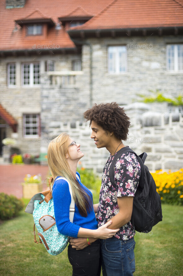 Young students hugging with backpacks Stock Photo by Image-Source ...