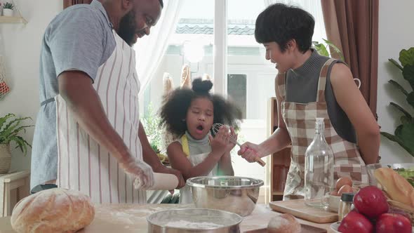Love moment of Happy black family having fun dancing and cooking together at home