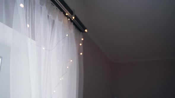 Tulle Decorated with a Thin LED Garland with Colorful Lights alt