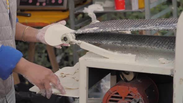Woman Make Dough in Tortilla Machine in Mexico alt