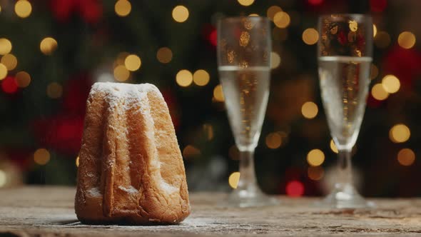 Glasses of Champagne and Panettone for New Year alt