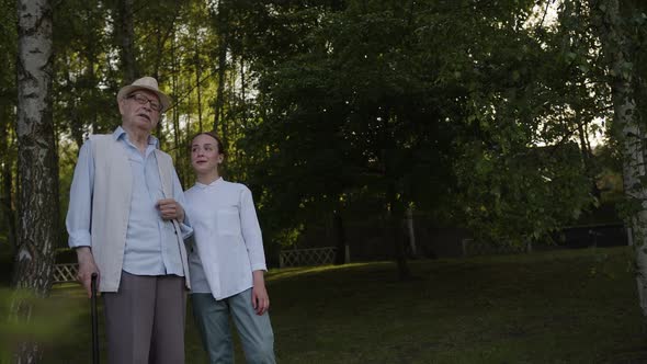 Nurse and Old Man with Stick Stand and Talk alt