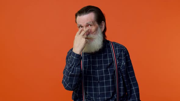 Elderly Man Pointing at Her Eyes and Camera Show I Am Watching you Gesture Spying on Someone alt