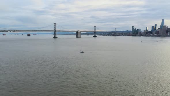 Aerial: a scenic vista of the city and the bridge, drone view alt