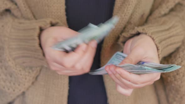 Woman Counting Money alt