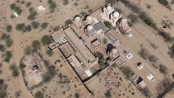 Aerial Overhead View Of Dome Rooftop Masjid At Derawar Fort. High Angle, Dolly Forward, Tilt Down alt